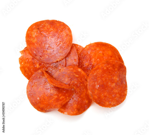 Slices of pepperoni on white background 