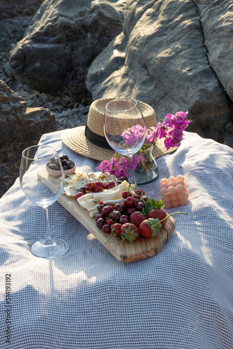 picnic by the sea. Wine, snacks.