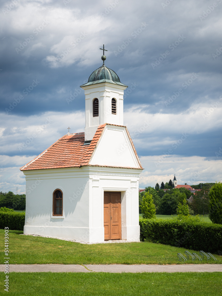  Small church on green field in rural spring landscape, Burgenland, Austria