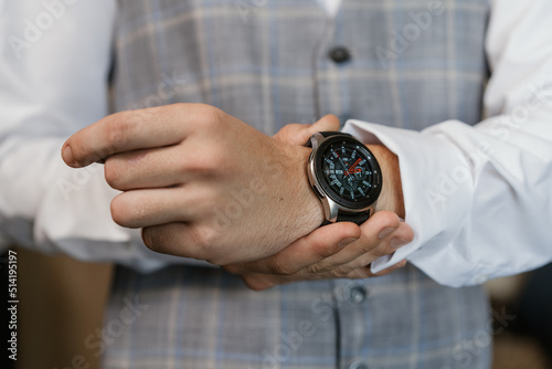 businessman holding clock