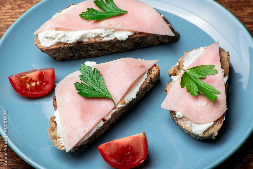 Toast with cheese and bacon on a blue plate. Toast with cheese and bacon on a blue plate.