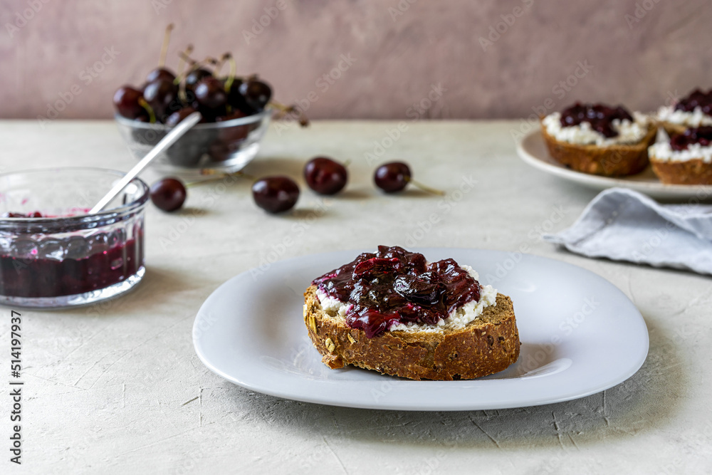 Wholewheat toasts with ricotta and homemade sweet cherry jam Wholewheat toasts with ricotta and homemade sweet cherry jam