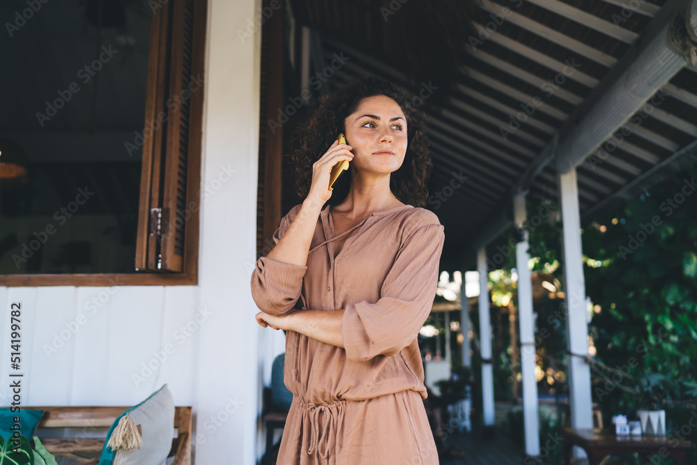 Caucasian woman in casual wear using roaming internet connection for making international conversation via mobile application, millennial female have consultancy communication via cellphone