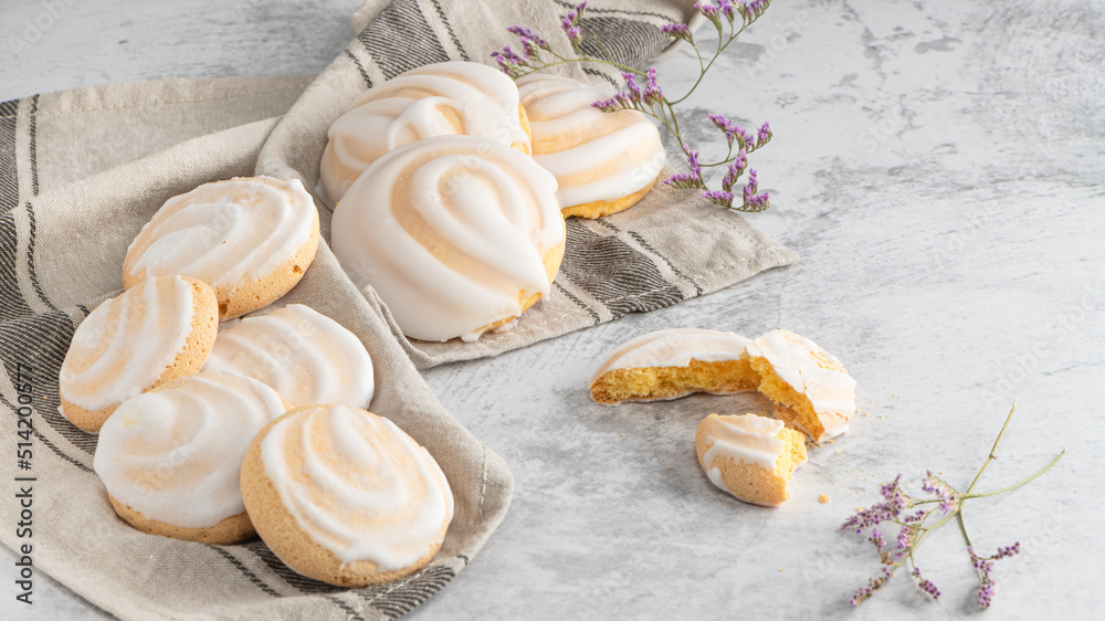 Portuguese sweets cavacas on napkin in a table. Typical cookies with sugar Portuguese sweets cavacas on napkin in a table. Typical cookies with sugar