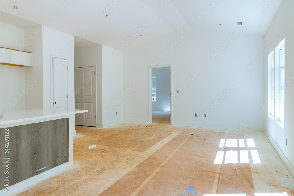 Obraz premium Assembly and installation of modern kitchen cabinets on new house