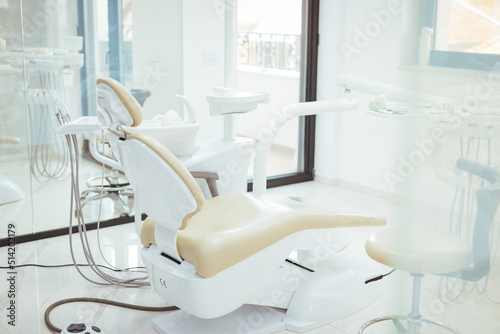Inside the dental office. Devices and equipment. Modern dentist room and new equipment inside. Interior of a modern medical clinic. Empty modern dentist room photo