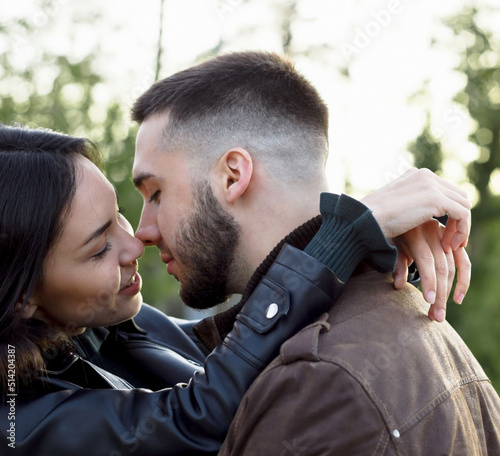 Beautiful couple in love on romantic dating, sensual relationship and desire of lovers, young man and woman almost kissing and spending time together outdoors, candid lifestyle