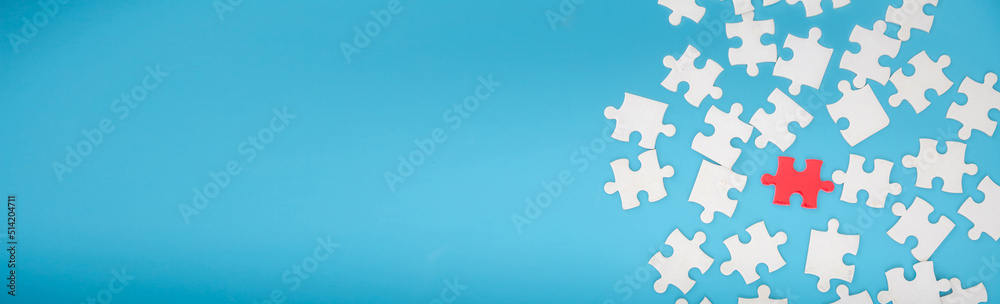 Top view of jigsaw puzzle on blue background Top view of jigsaw puzzle on blue background