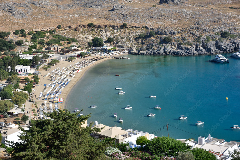 Harbour and beach in Lindos town. Rhodes, Greece. Turqouise Mediterranean Sea.