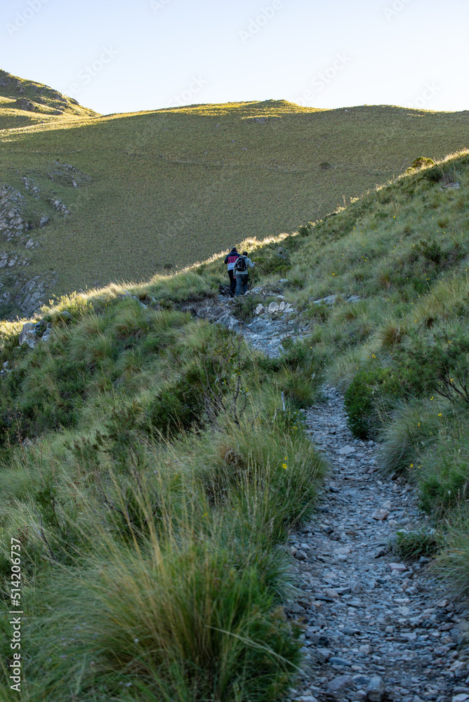 Rear view of Two Friends Hiking on a Mountain at Day Time.Vertical Image.Copy Space