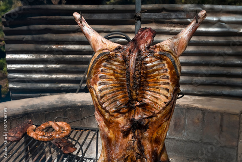 Lamb on the spit, cooked with the traditional Argentine method, La Pampa province, Patagonia, Argentina.