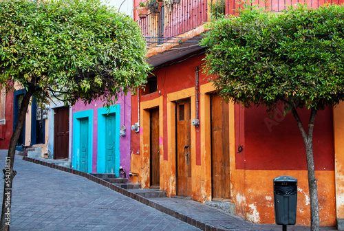 Exterior view of colorful historical old town buildings in the downtown of Guanajuato state, Mexico. Vivid, multicolored colonial neighborhood with traditional Mexican architecture.