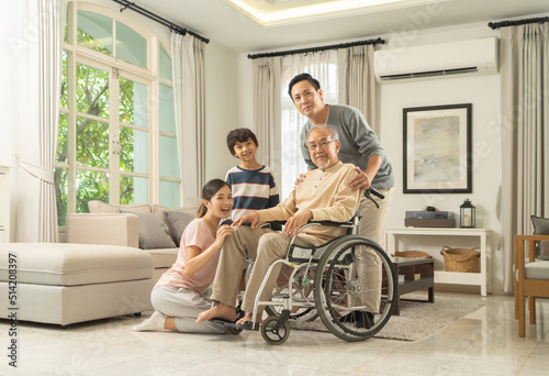 Portrait of happy smiling Asian Family living together at home in family relationship. reunion. Love of father, mother,grandfather and son. People lifestyle.