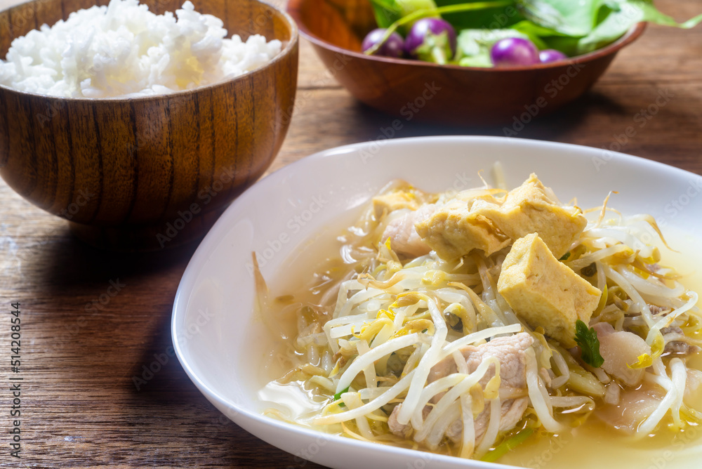 Stir fry bean sprouts with tofu on a wooden table. Healthy menu. Stir fry bean sprouts with tofu on a wooden table. Healthy menu.