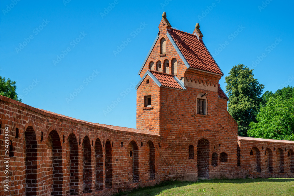 St. Lawrence, erected in the Gothic style with a defensive wall in 1518 in Kleczków in Masovia, Poland. General view and details of the construction of the temple and wall at the photo.