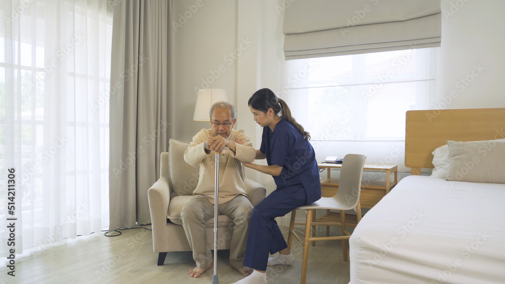 © tampatra - Asian woman nurse, daughter help father to get up from chair, supporting old senior elderly patient in bedroom in home or house in medical and healthcare. People lifestyle. Family disability therapy. © tampatra - Asian woman nurse, daughter help father to get up from chair, supporting old senior elderly patient in bedroom in home or house in medical and healthcare. People lifestyle. Family disability therapy.