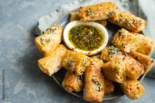 Over fried potato rolls with chili honey