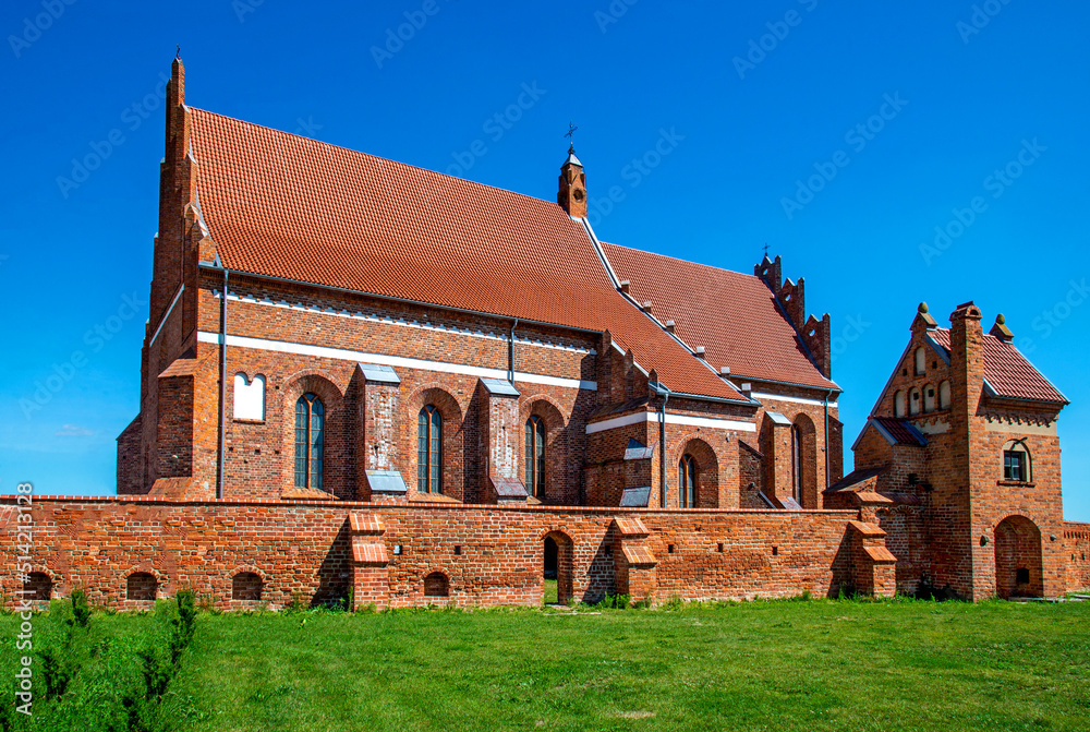 St. Lawrence, erected in the Gothic style with a defensive wall in 1518 in Kleczków in Masovia, Poland. General view and details of the construction of the temple and wall at the photo. St. Lawrence, erected in the Gothic style with a defensive wall in 1518 in Kleczków in Masovia, Poland. General view and details of the construction of the temple and wall at the photo.