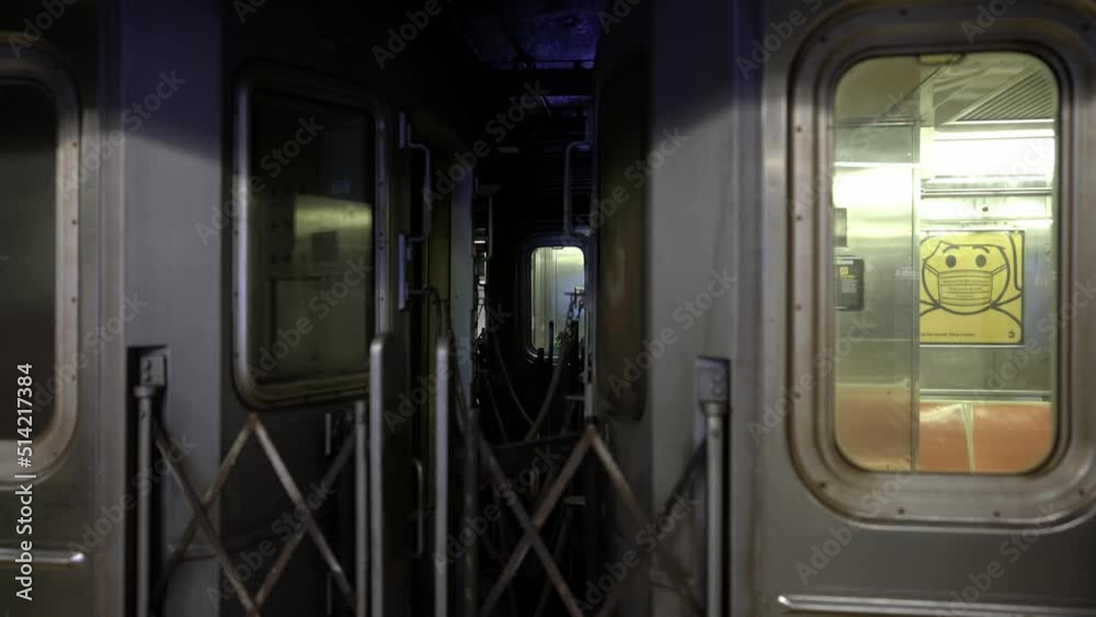 New York city subway in Station. Train passing in background. View between Subway cars. Old NYC metro train