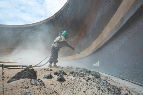 Female worker surface corrosion plate preparation by sand blasting