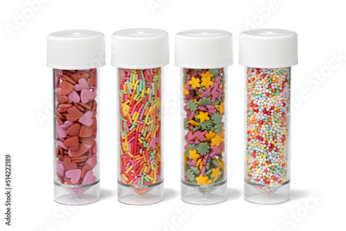 Obraz na plátně Plastic tubes with colorful sugar sprinkles to decorate homemade pastry isolated