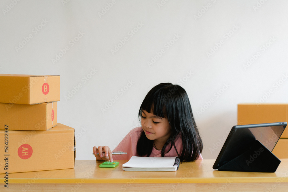 Portrait of asian girl packing box and check list in office business, SME internet work from home. Portrait of asian girl packing box and check list in office business, SME internet work from home.