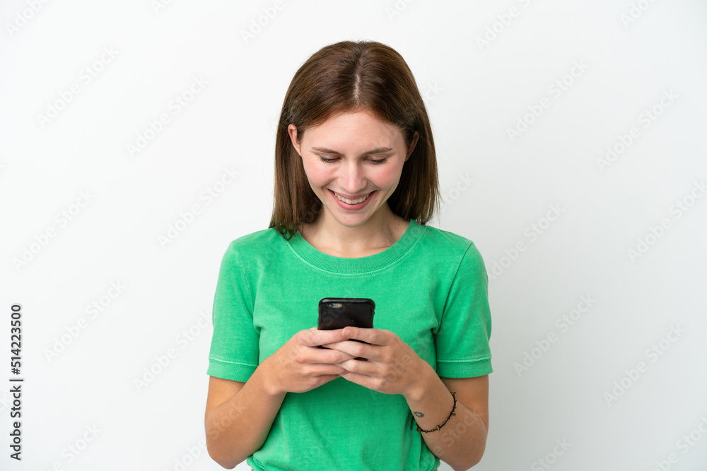 Young English woman isolated on white background sending a message or email with the mobile Young English woman isolated on white background sending a message or email with the mobile