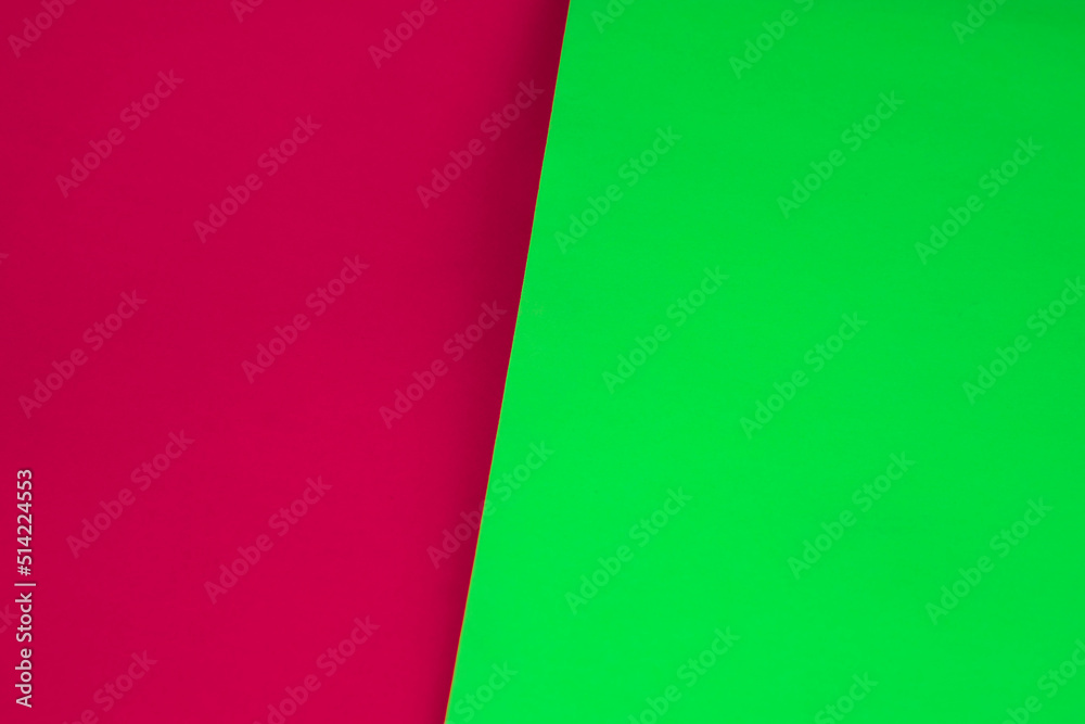 Dark vs light abstract Background with plain subtle smooth de saturated red pink neon green colours parted into two