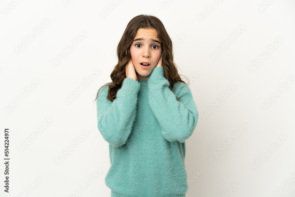 Little caucasian girl isolated on white background frustrated and covering ears Little caucasian girl isolated on white background frustrated and covering ears