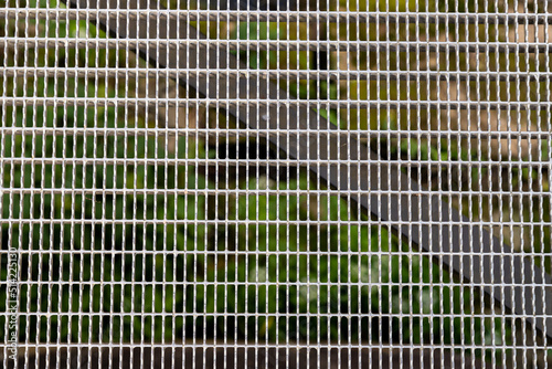 The surface of the metal grid for the floor.