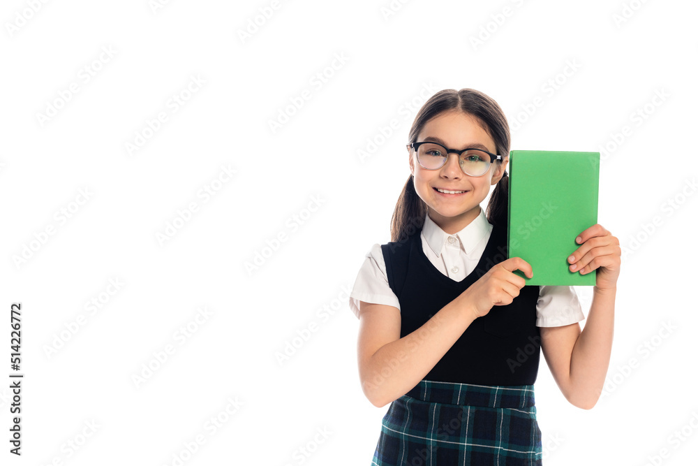 Positive schoolkid in eyeglasses holding book isolated on white. Positive schoolkid in eyeglasses holding book isolated on white.
