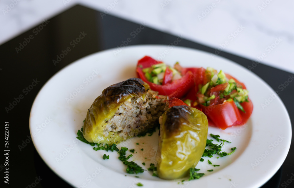Traditional Turkish Rice Stuffed Bell Peppers With Sallad Close-Up Traditional Turkish Rice Stuffed Bell Peppers With Sallad Close-Up
