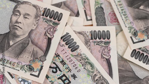 Closeup of Japanese accounting 1,000 yen banknotes money saving cash for the economy.