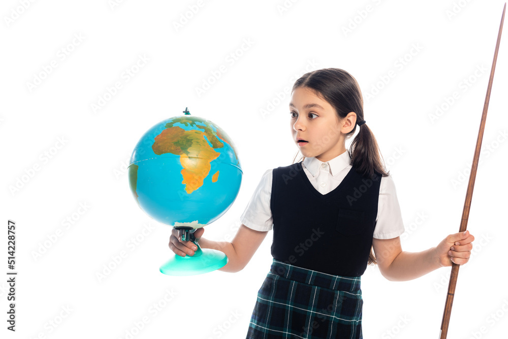 Shocked schoolgirl holding pointer and looking at globe isolated on white. Shocked schoolgirl holding pointer and looking at globe isolated on white.
