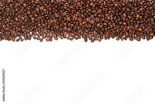 Roasted coffee beans. Top view brown coffee beans texture isolated on white