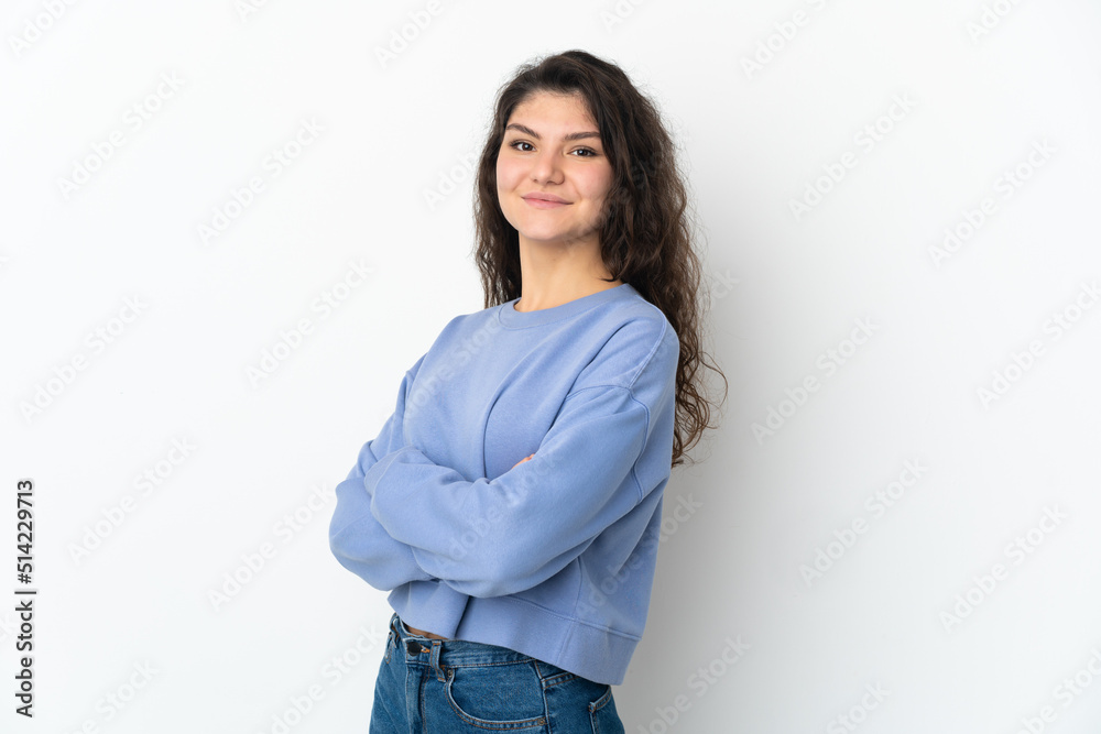 Teenager Russian girl isolated on white background with arms crossed and looking forward