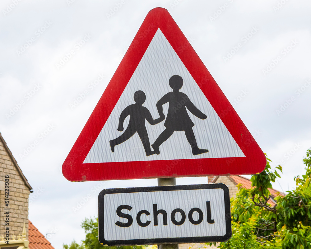 Caution Children Crossing Sign near a School in the UK Caution Children Crossing Sign near a School in the UK