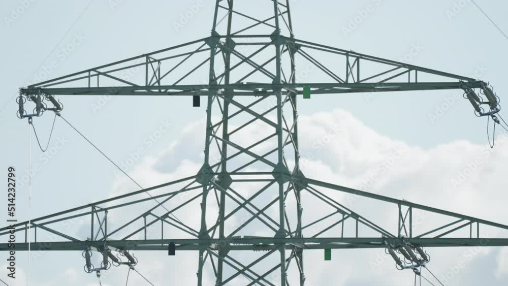A close-up shot of the electrical power lines. Slow-motion, pan right A close-up shot of the electrical power lines. Slow-motion, pan right
