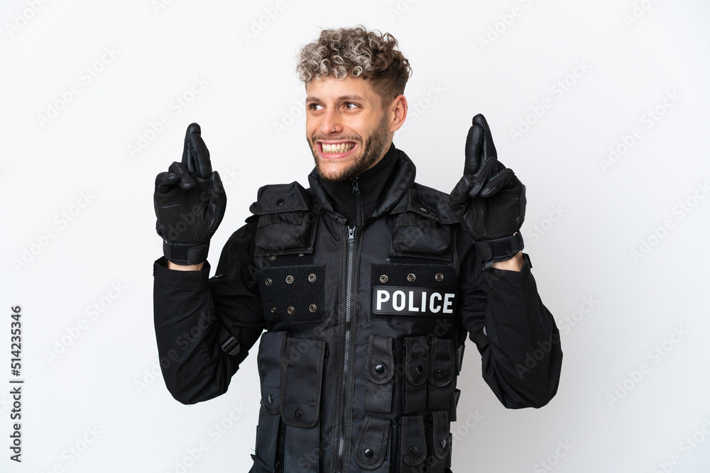 SWAT caucasian man isolated on white background with fingers crossing SWAT caucasian man isolated on white background with fingers crossing