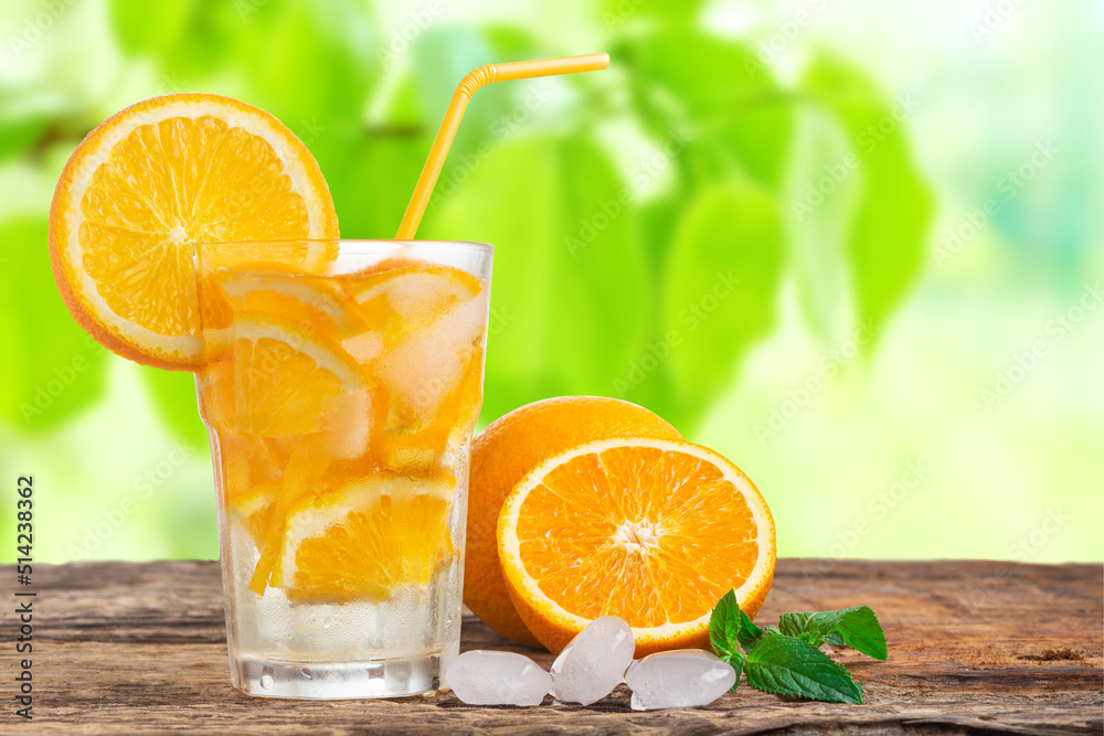 Natural lemonade with mint and fresh oranges on wooden table. Natural lemonade with mint and fresh oranges on wooden table.