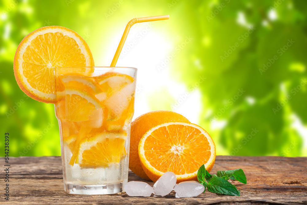 Natural lemonade with mint and fresh oranges on wooden table. Natural lemonade with mint and fresh oranges on wooden table.