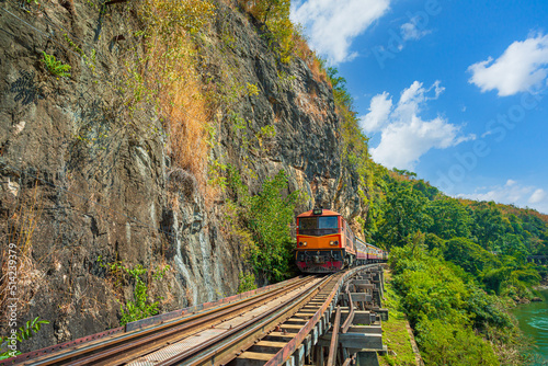 death railway,trains running on death railways track crossing kwai river in kanchanaburi thailand © banjongseal324
