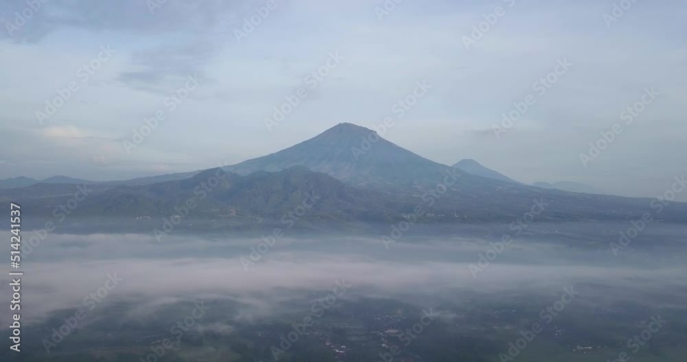 rural view and Mount Sumbing, central java, Indonesia. foggy weather in morning with a view of the mountains. Indonesian landscape rural view and Mount Sumbing, central java, Indonesia. foggy weather in morning with a view of the mountains. Indonesian landscape