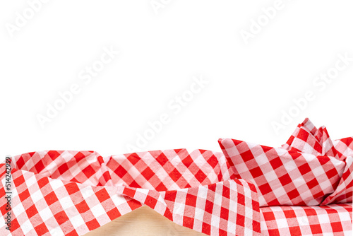 Closeup of a empty straw basket with a red checkered napkin and a folded ship isolated on a white background. For your food and product display montage. Macro.