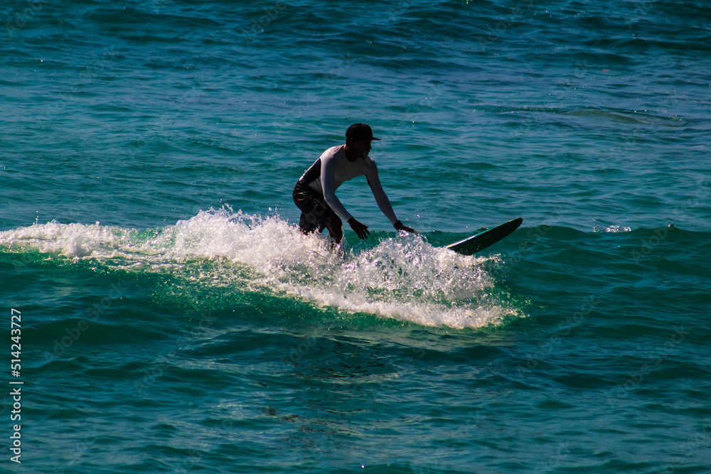 blue intense sea with a surfer ride the waves in carrizalillo puerto escondido oaxaca blue intense sea with a surfer ride the waves in carrizalillo puerto escondido oaxaca