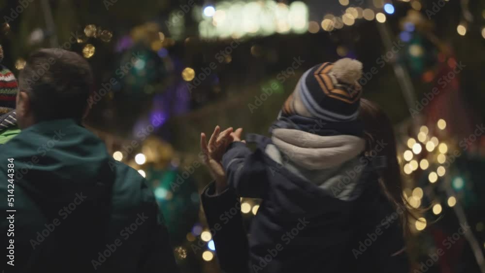 parents dancing with children close Christmas tree, magic night parents dancing with children close Christmas tree, magic night
