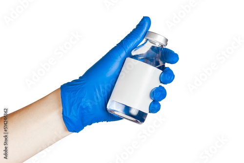 A bottle of saline in the doctor's hand. Medical procedures. photo