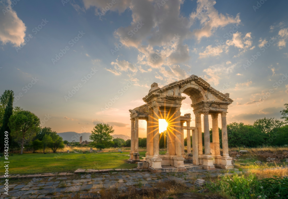 Ancient city of Aphrodisias. (Aphrodisias). Sunset through the columns of the Tphrodisias Tetrapyhlon