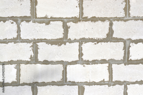 Old brick wall. Ancient stone texture background. Urban background, white ruined industrial brick wall with copy space. Home and office design backdrop. Vintage effect. 