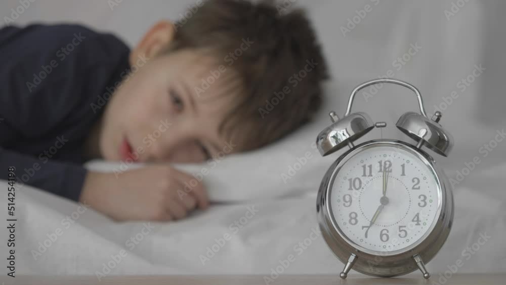 Kid wakes up by clock ringing, late for school